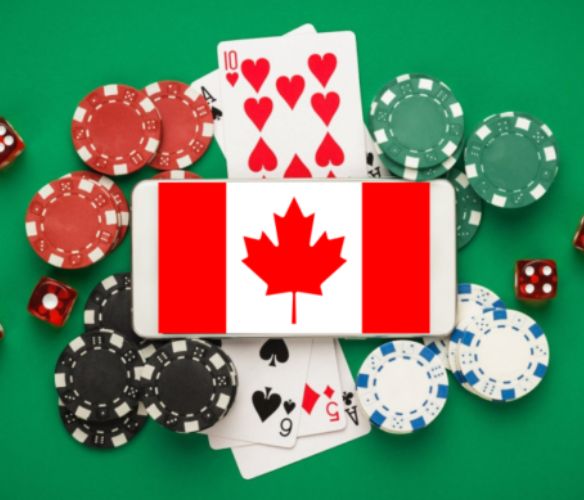 Casino card, chips, dice and phone with canadian flag